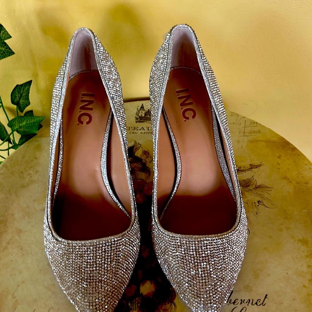 Woman’s diamond studded dress heals worn once. Size 7.